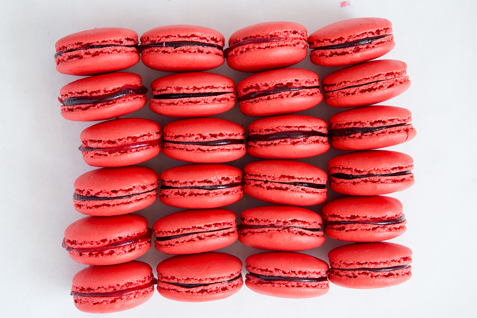 raspberry macarons in a row image macaron franchise