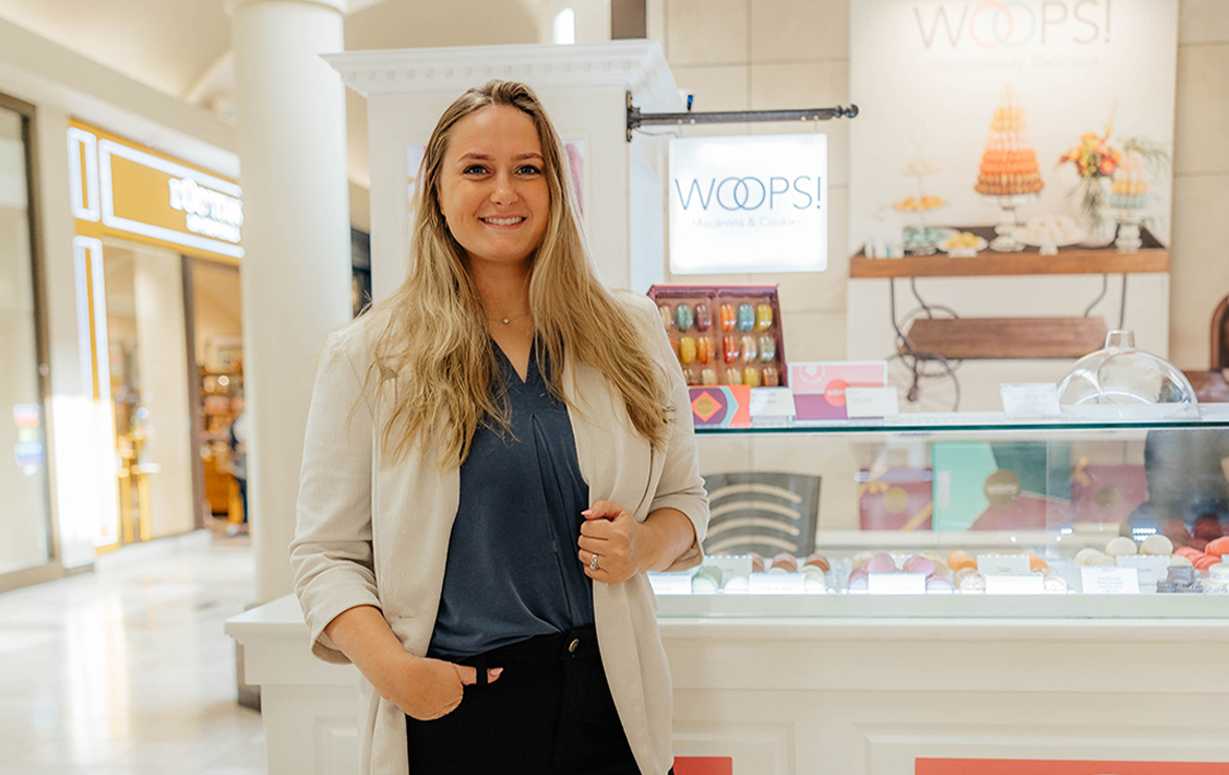 A women in front of a Woops! venue.